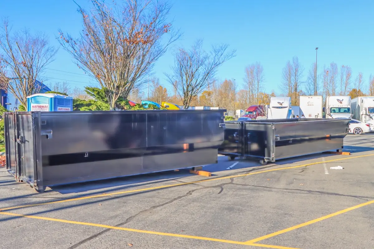 Professional dumpster rental service with roll-off container on residential driveway in South Lake Tahoe